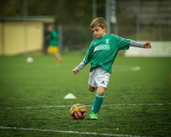 Child playing soccer